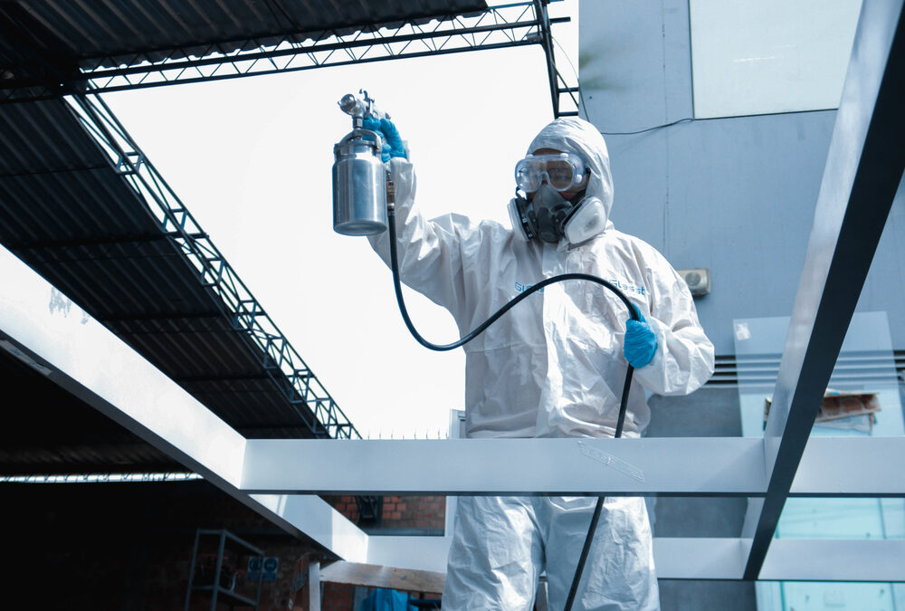 Professional pest control technician inspecting a commercial office building for pest activity in Singapore
